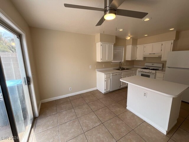 kitchen featuring ceiling fan, white cabinetry, light tile patterned floors, white appliances, and sink