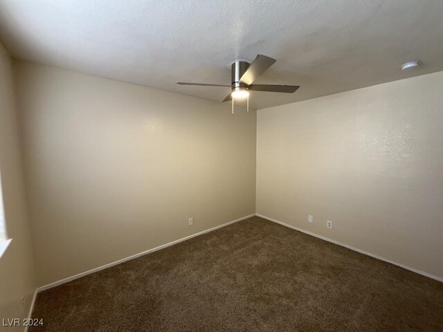 spare room with carpet flooring and ceiling fan