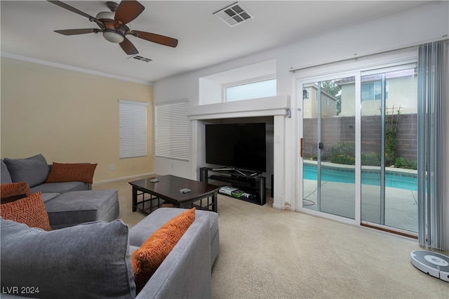 living room featuring carpet and ceiling fan