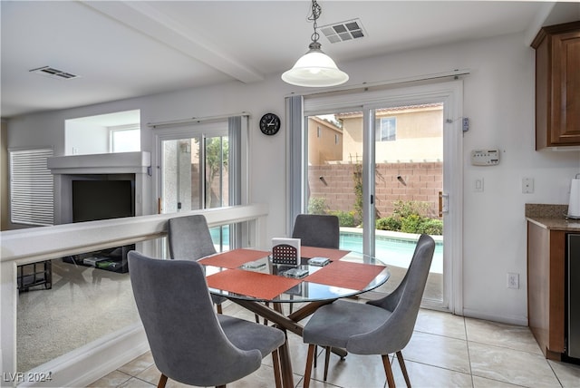 dining area with light tile patterned flooring