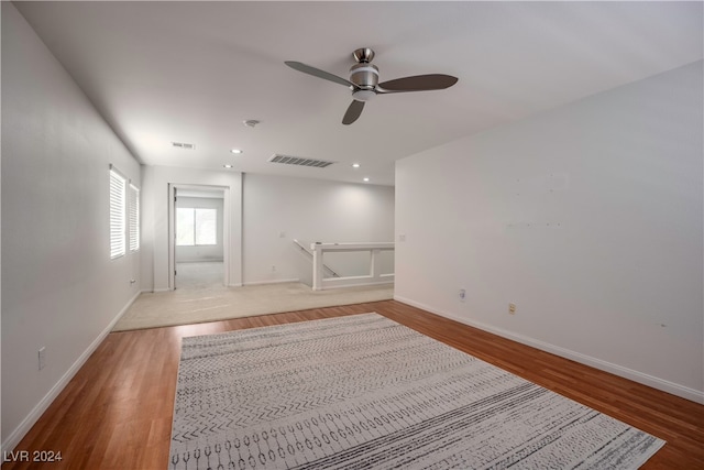 unfurnished room with ceiling fan and light hardwood / wood-style floors