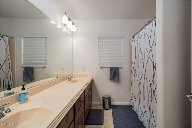 bathroom featuring tile patterned floors and double vanity