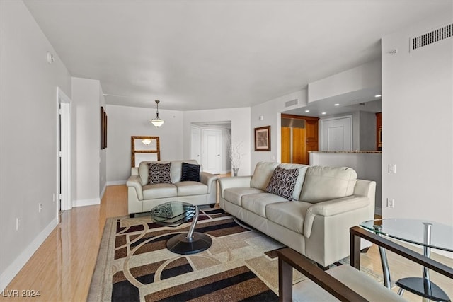 living room with light hardwood / wood-style floors