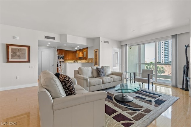 living room with light hardwood / wood-style floors