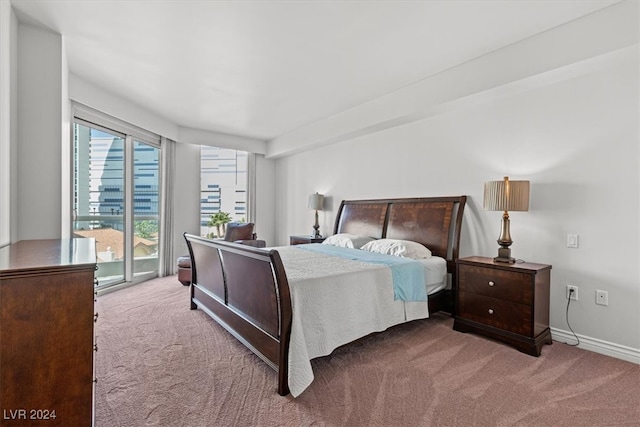 carpeted bedroom featuring access to exterior