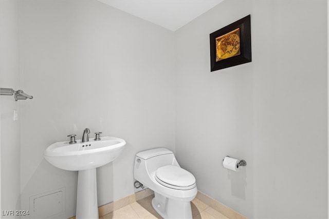 bathroom featuring tile patterned flooring and toilet