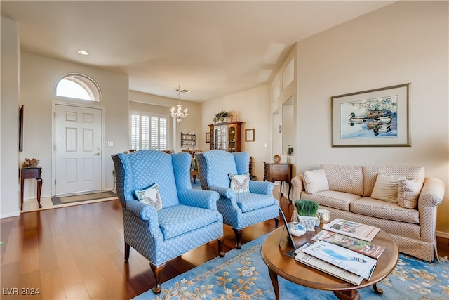 living room featuring hardwood / wood-style floors and a chandelier