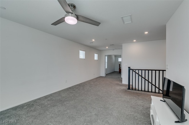 interior space with ceiling fan