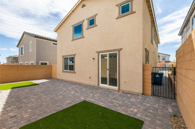 rear view of house with a patio