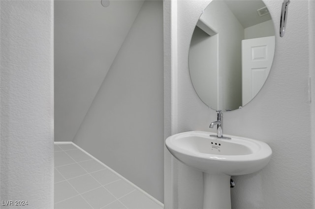 bathroom with tile patterned floors