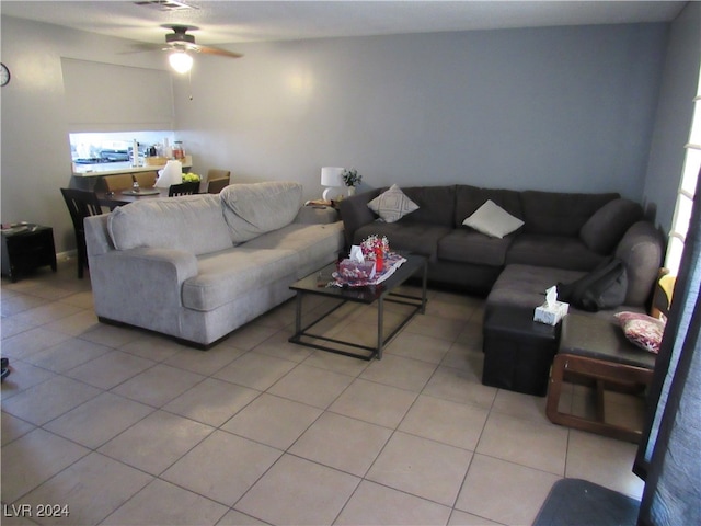 living room with ceiling fan and light tile patterned floors