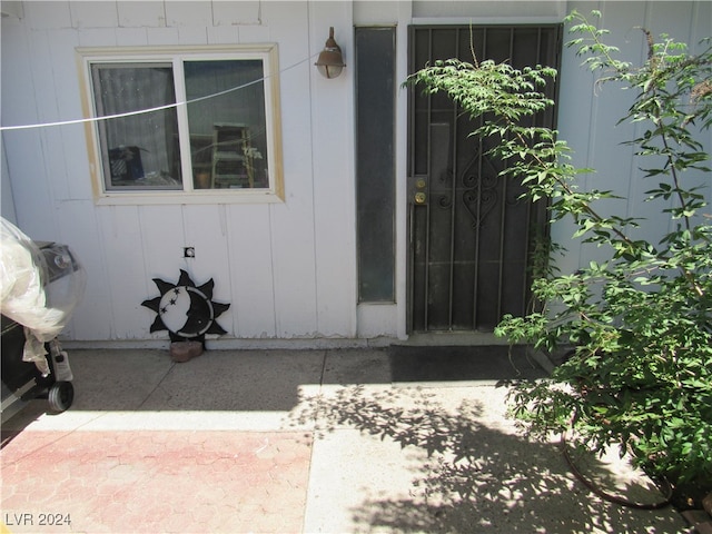 property entrance with a patio area