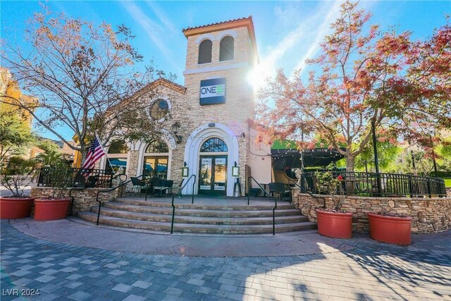 30 Strada Di Villaggio 204, Henderson, NV 89011 - view of front of home with french doors and stone siding