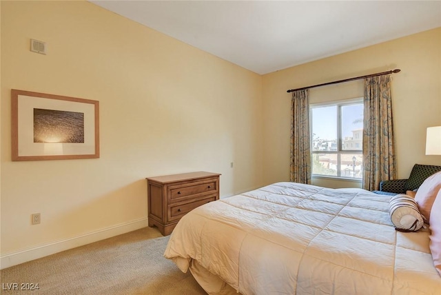 30 Strada Di Villaggio 204, Henderson, NV 89011 - bedroom featuring baseboards and light colored carpet