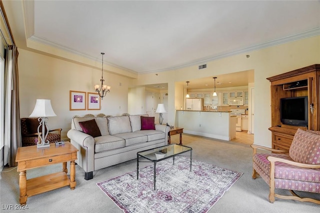 30 Strada Di Villaggio 204, Henderson, NV 89011 - living room featuring light colored carpet, ornamental molding, and a chandelier