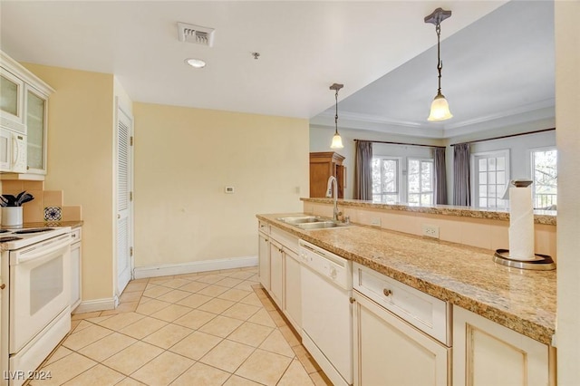 30 Strada Di Villaggio 204, Henderson, NV 89011 - kitchen with white appliances, pendant lighting, light tile patterned floors, glass insert cabinets, and ornamental molding