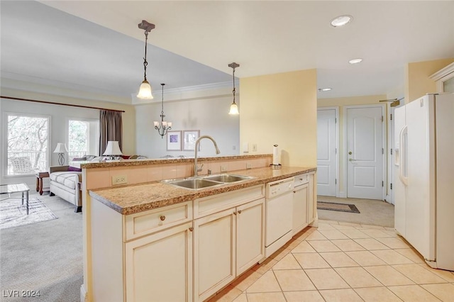 30 Strada Di Villaggio 204, Henderson, NV 89011 - kitchen with white appliances, light carpet, decorative light fixtures, a peninsula, and light countertops