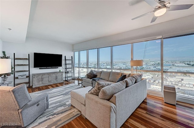 living room featuring ceiling fan and wood finished floors