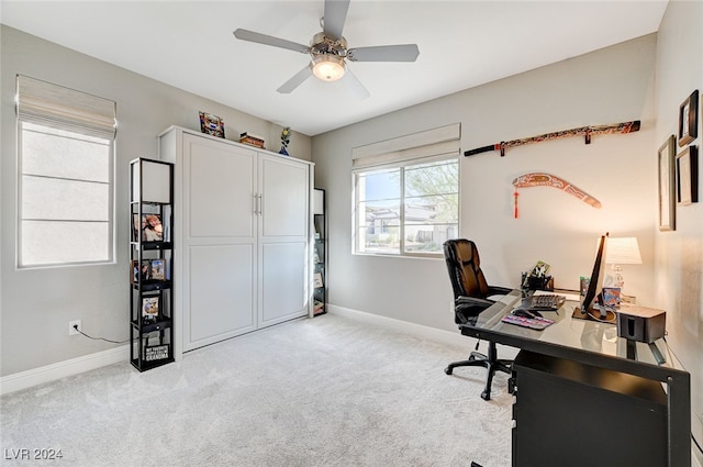 office featuring ceiling fan and light carpet