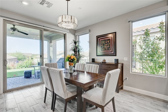 dining area featuring a healthy amount of sunlight and light hardwood / wood-style flooring