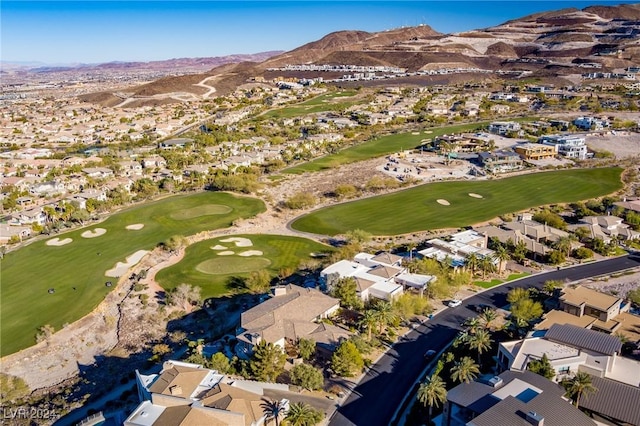 birds eye view of property featuring a residential view, view of golf course, and a mountain view