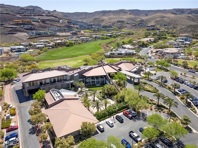 drone / aerial view with view of golf course and a mountain view