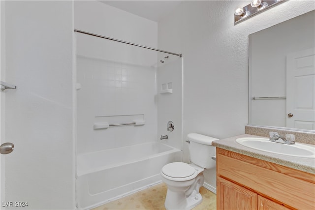 full bathroom featuring toilet, vanity, tile patterned floors, and washtub / shower combination