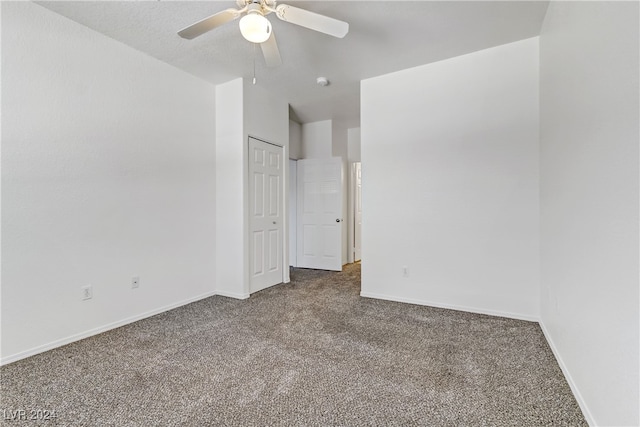 unfurnished room with carpet floors and ceiling fan