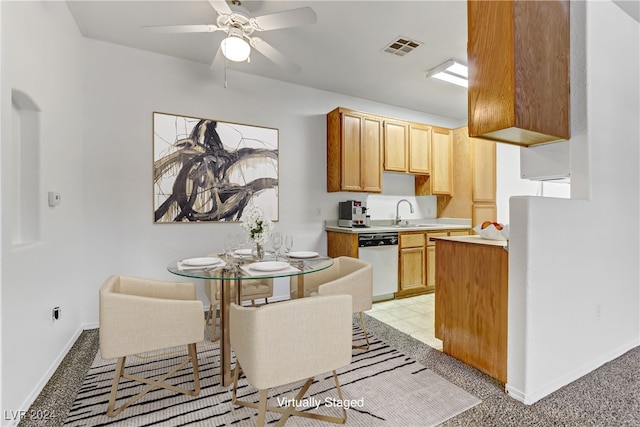 kitchen featuring sink, light carpet, dishwasher, and ceiling fan