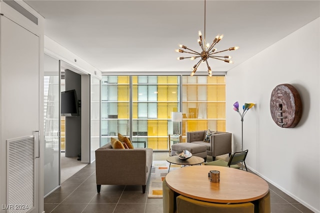 living room with a notable chandelier and tile patterned flooring