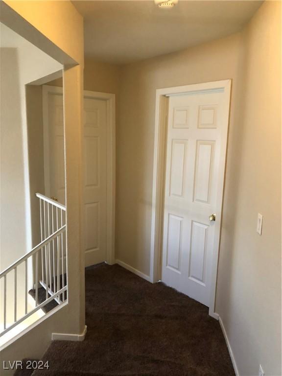 hallway featuring carpet flooring