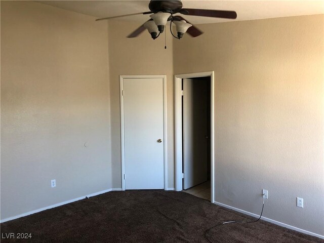 unfurnished bedroom with carpet floors and a ceiling fan