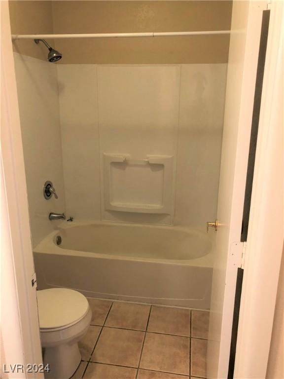 full bath with toilet and tile patterned floors