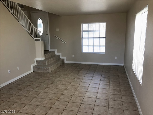 interior space with tile patterned flooring and a healthy amount of sunlight