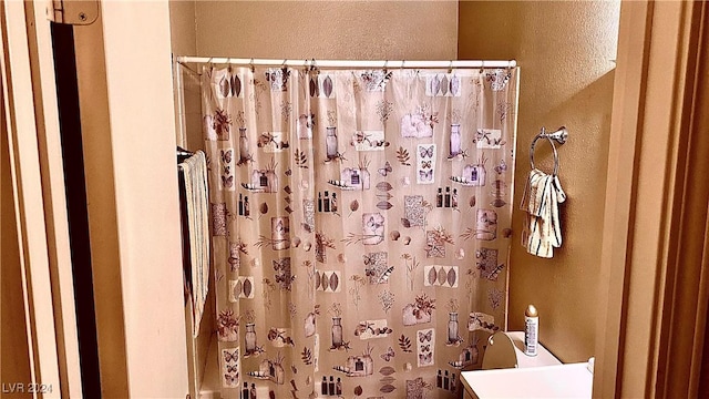 bathroom with a shower with shower curtain