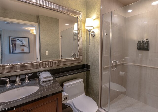 bathroom with vanity, toilet, and walk in shower