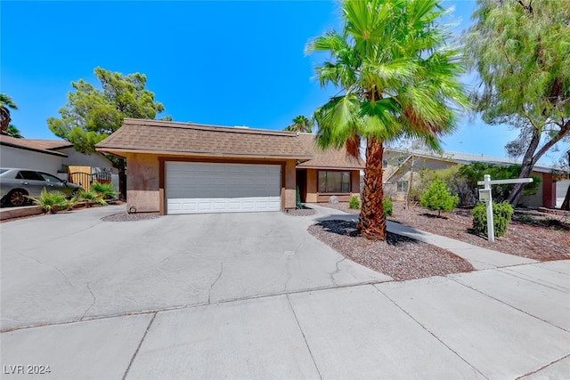 ranch-style home featuring a garage