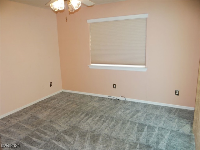 spare room with ceiling fan and carpet floors