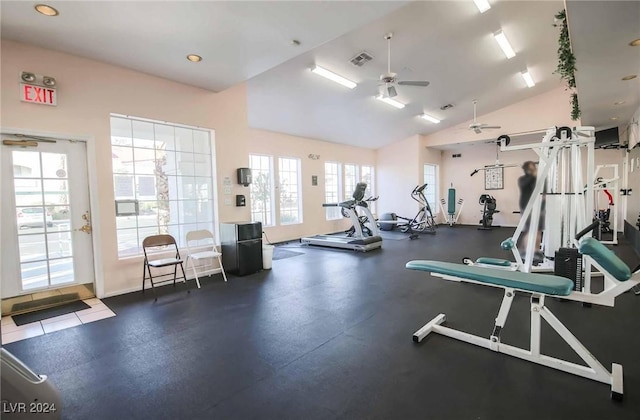 exercise room with ceiling fan and lofted ceiling