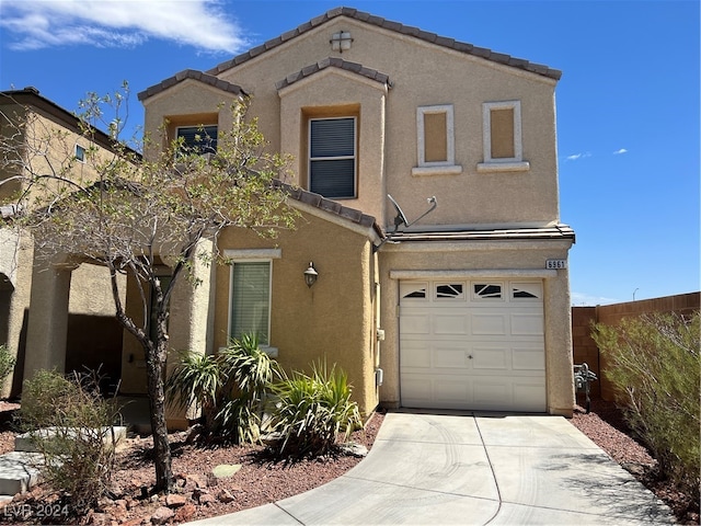 view of front of property with a garage