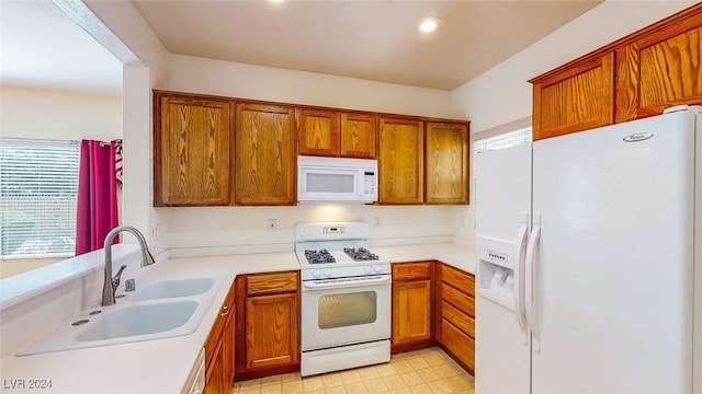 kitchen with sink and white appliances