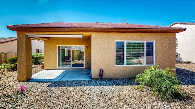 back of property with a patio area