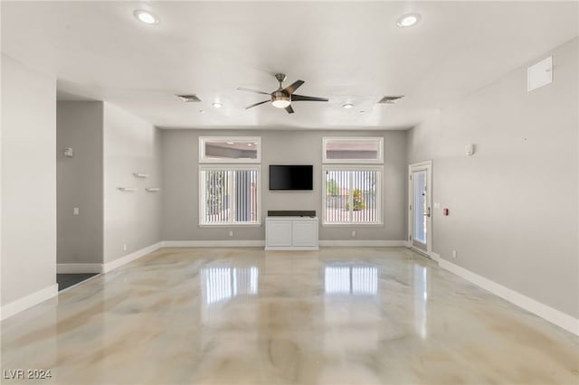 unfurnished living room with ceiling fan