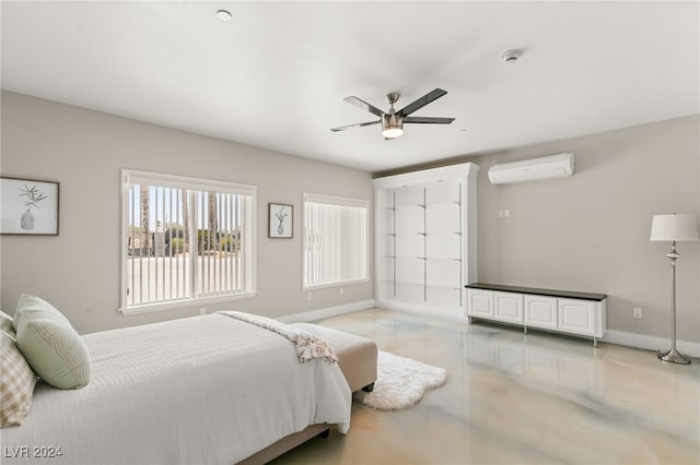 bedroom featuring ceiling fan and an AC wall unit