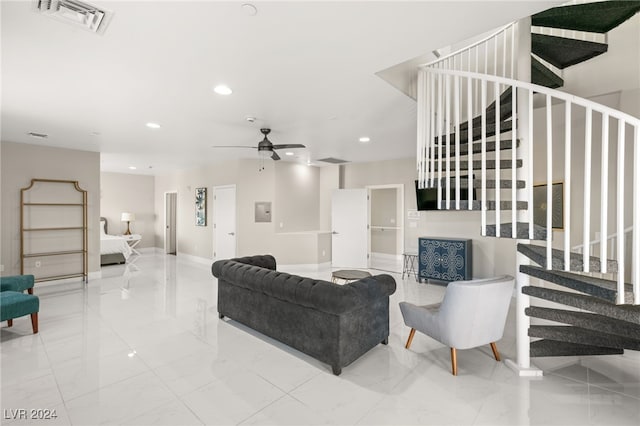 tiled living room with ceiling fan