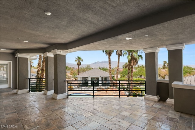 view of patio / terrace featuring a balcony and a mountain view