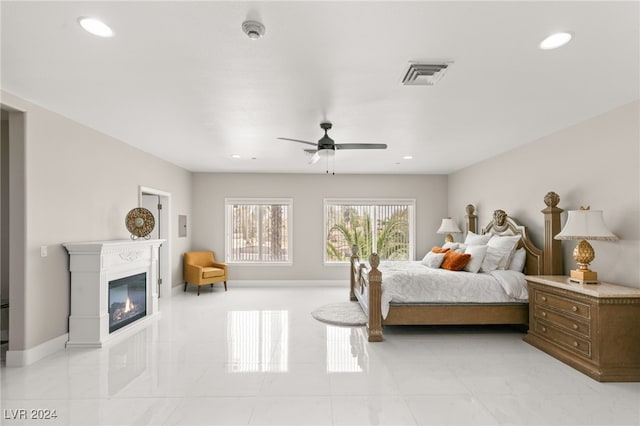 bedroom featuring ceiling fan and light tile patterned floors