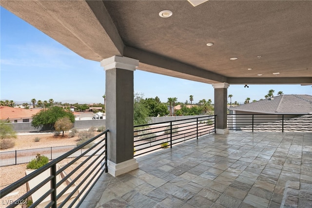 view of patio featuring a balcony