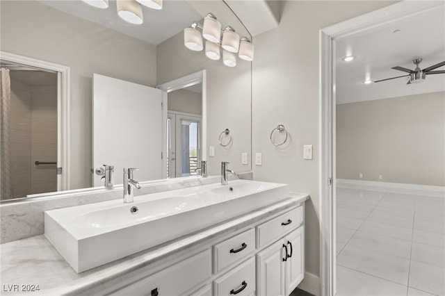 bathroom with ceiling fan, tile patterned flooring, and dual bowl vanity