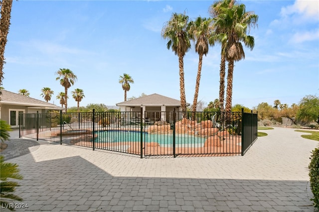 view of swimming pool with a patio area